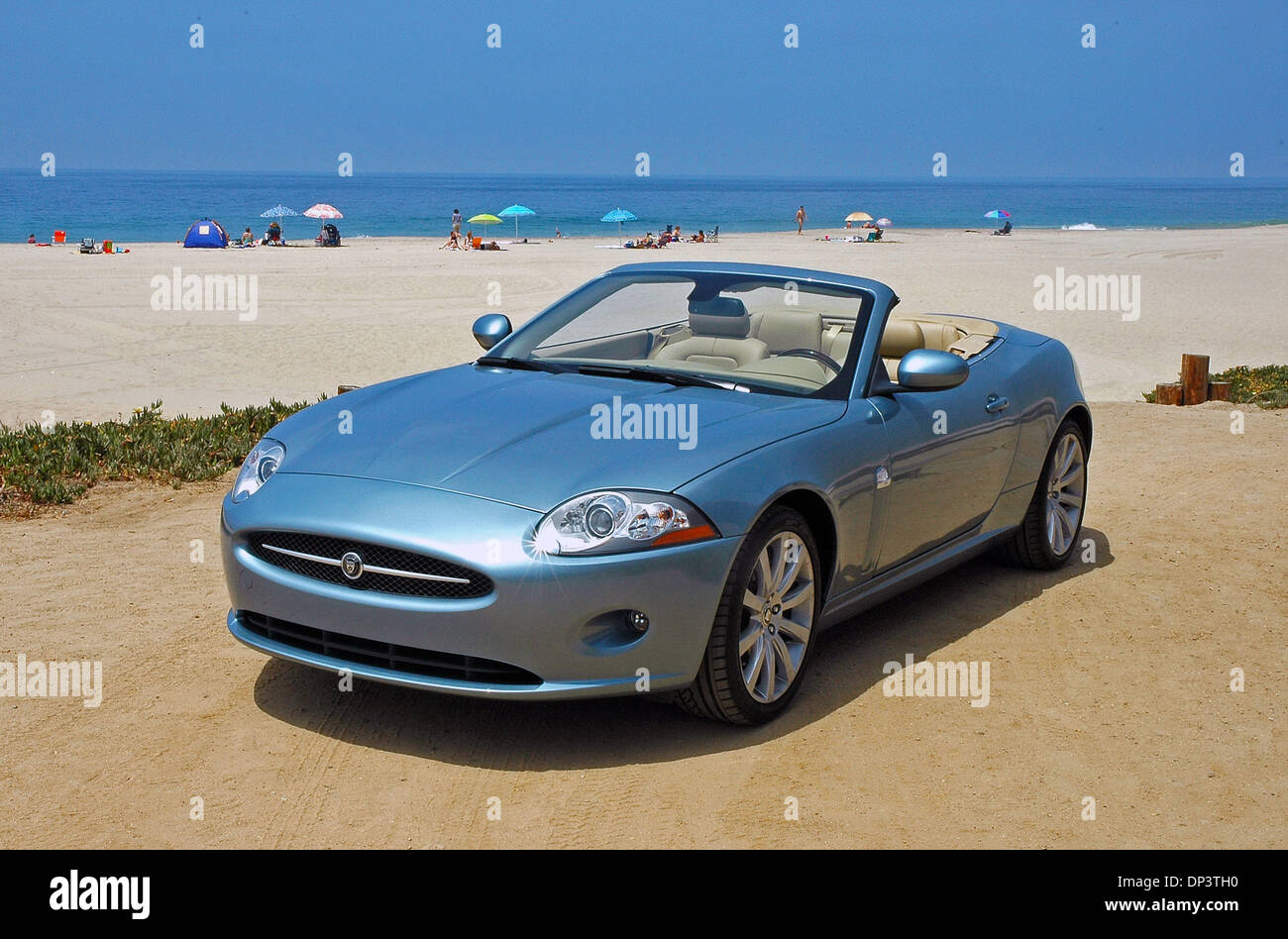 Jul 17, 2006; Los Angeles, CA, USA; All-new 2007 Jaguar XK convertible beauty portrait on the sand at Zuma Beach. The 2007 Jaguar XK has a new aluminum chassis and body, new 'cat's-eye' HID headlamps, interior design and leather trimmed, fully-adjustable front bucket seats that are more comfortable and supportive with 2in. more legroom, a red 'Start' button on the center console, p Stock Photo