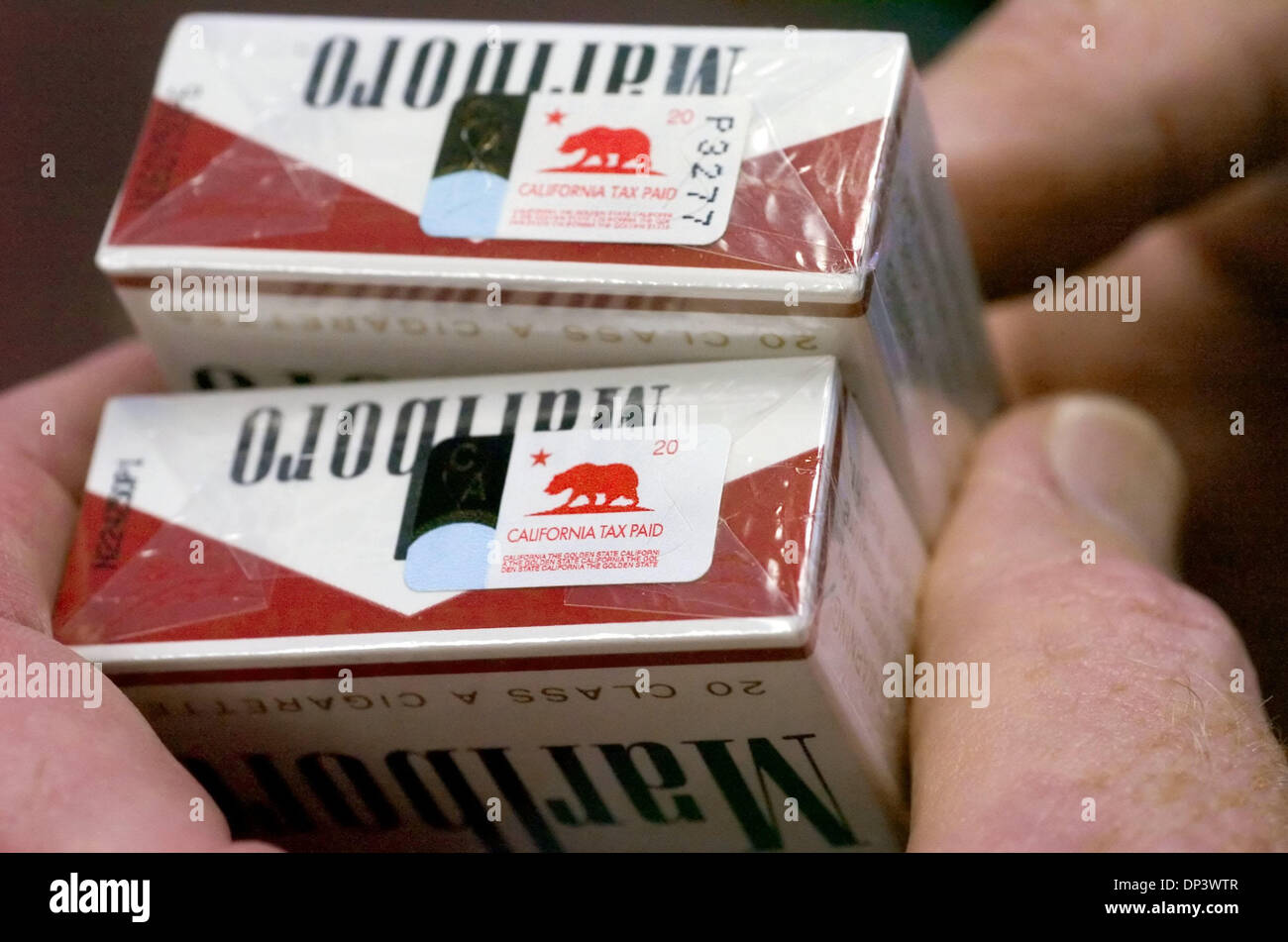 cigarette tax stamps collection Jul 18, 2006; Sacramento, CA, USA; State Board of Equalization Deputy  Director David Gau holds two packs of cigarettes with California tax stamps  at the State of California Board of Equalization office