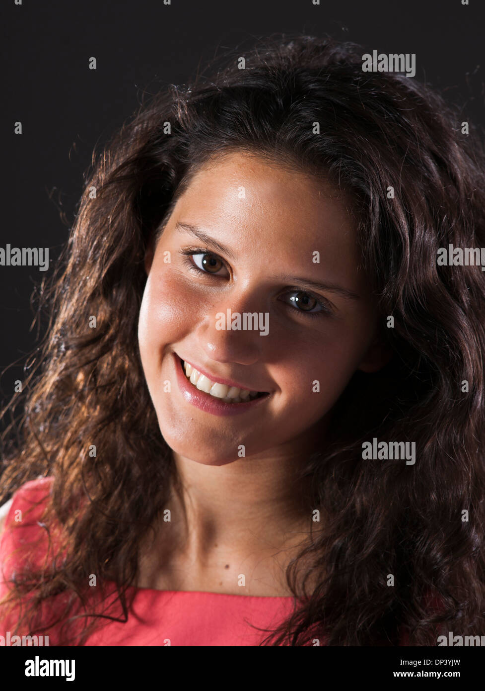 Portrait of teenage girl smiling and looking at camera Stock Photo - Alamy