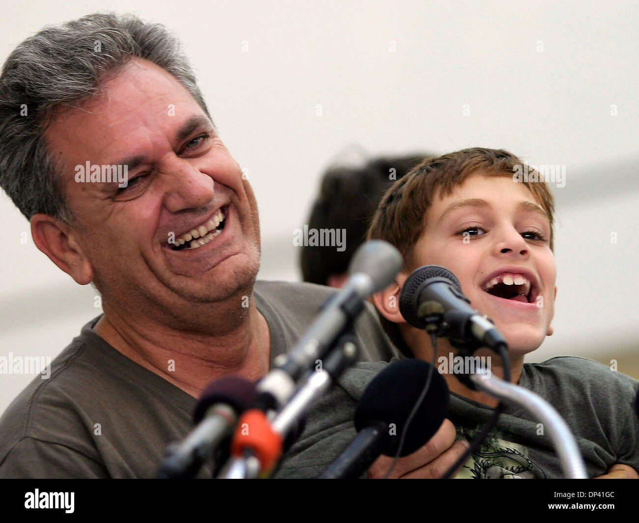 Jul 20, 2006; Baltimore, Maryland, USA; TOM CHARARA and his son ALI speak to the press about his experience fleeing Lebanon where the Israeli - Hezbollah conflict continues to intensify. The first flight of American refugees from Lebanon arrived at BWI Airport (Baltimore/Washington) this morning. Most were American citizens visiting Lebanon at the time of the most recent attacks by Stock Photo