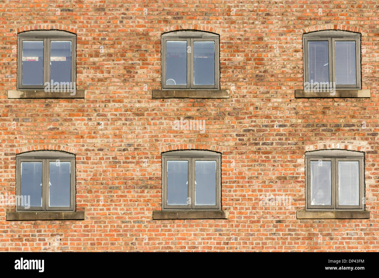 Brick wall and windows of one of the historic buildings in Newcastle Upon Tyne Stock Photo