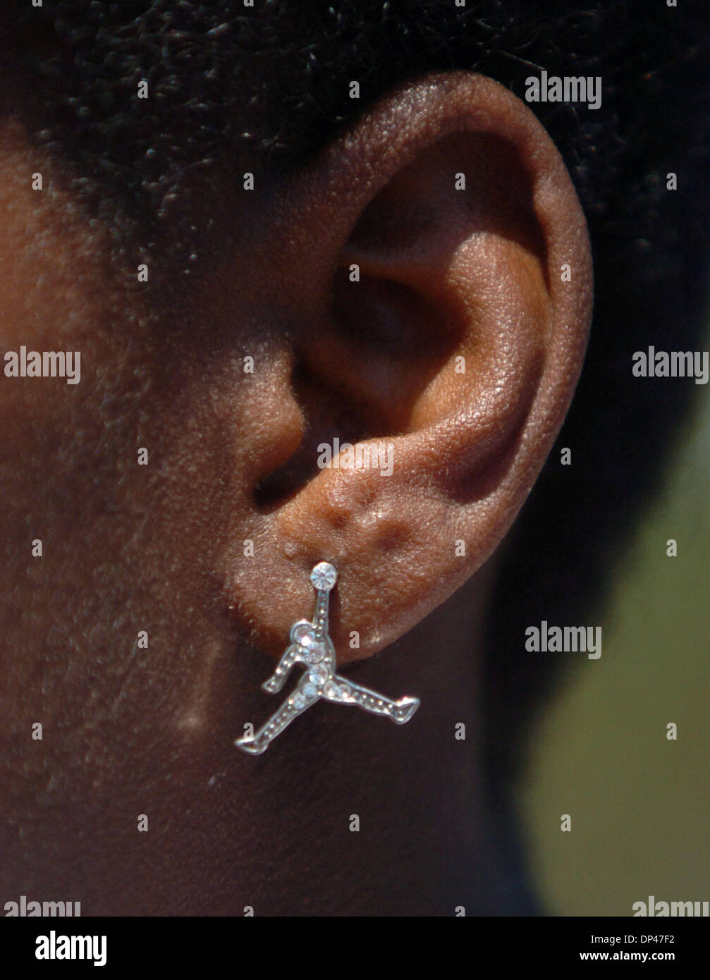 Jul 29, 2006; San Pablo, CA, USA; AARON AUSTIN, 15, sports an Air Jordan earring at the BSAA (Black Sports Agents Association) sports and dance clinic at Contra Costa College. The clinic, thrown by Andre Farr, a former Kennedy High School and UCLA football player, featured motivational speakers and professional coaches giving instruction in basketball, football and dance among othe Stock Photo