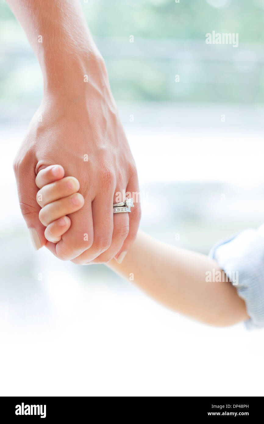 Two boys holding hands hi-res stock photography and images - Alamy