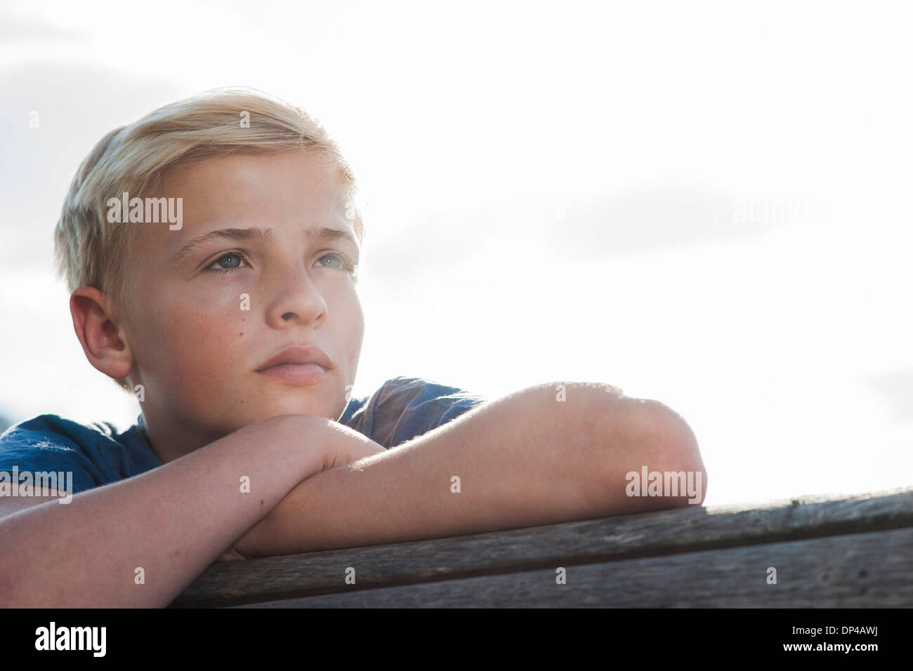 Close-up portrait of boy outdoors, looking into the distance, Germany Stock Photo
