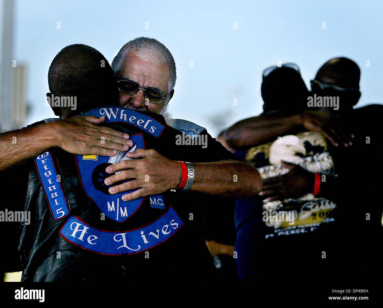 Aug 04, 2006; Fort Pierce, FL, USA; than Gramm, facing, of the Christian Motorcyclists Association, hugs Harry Gumby, left, during the National Bikers Roundup at the St. Lucie County Fairgrounds after a Sunday morning church service. Mandatory Credit: Photo by Meghan McCarthy/Palm Beach Post/ZUMA Press. (©) Copyright 2006 by Palm Beach Post Stock Photo