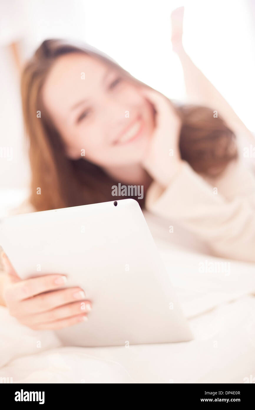 Young woman using a tablet computer Stock Photo