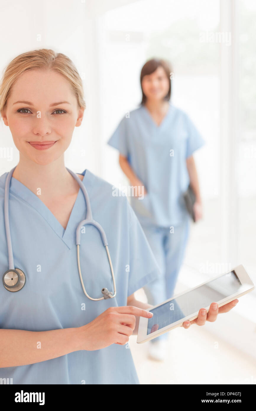 Doctor using a tablet computer Stock Photo