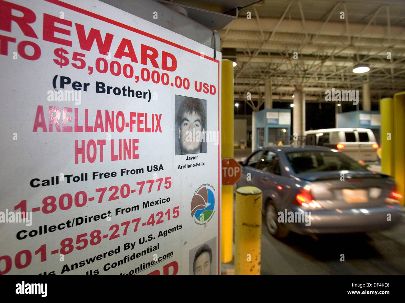 Aug 16, 2006; San Diego, CA, USA; A sign announces the reward for the arrest of Javier Arellano-Felix directed at vehicles entering the U.S. on one of the lanes at the Otay Mesa Port of Entry. This is one of many of these signs, in English and in Spanish, posted at the many port of entry lanes at this busy international border crossing. Federal law enforcement agents arrested Arell Stock Photo