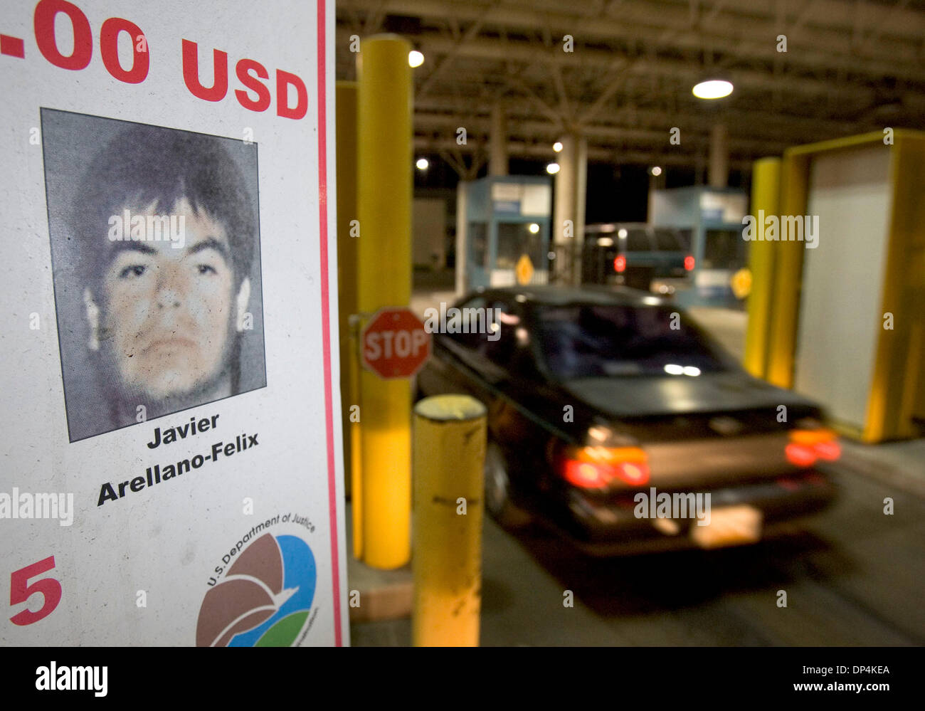 Aug 16, 2006; San Diego, CA, USA; A sign announces the reward for the arrest of Javier Arellano-Felix directed at vehicles entering the U.S. on one of the lanes at the Otay Mesa Port of Entry. This is one of many of these signs, in English and in Spanish, posted at the many port of entry lanes at this busy international border crossing. Federal law enforcement agents arrested Arell Stock Photo