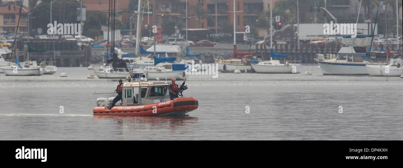 Aug 17, 2006; San Diego, CA, USA; A Coast Guard Rigid Hull Inflatable boat does security work pior to the arrival of the 87-foot cutter Petrel with Javier Arellano Felix and those captured with him aboard  to  the dock of the Coast Guard station on Harbor Drive. Also known as  'El Tigrillo,' or 'little tiger,' Arellano, 37, is one of seven leaders in the Arellano Felix organization Stock Photo