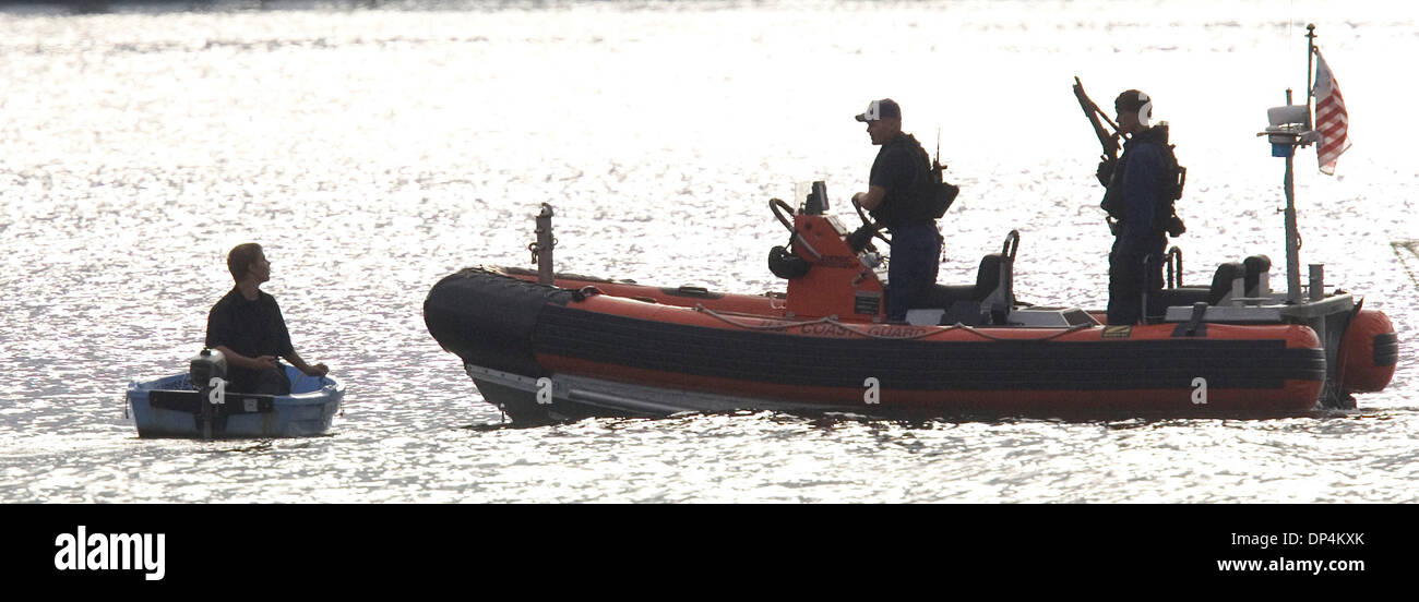 Aug 17, 2006; San Diego, CA, USA; A Coast Guard Rigid Hull Inflatable boat does security work pior to the arrival of the 87-foot cutter Petrel with Javier Arellano Felix and those captured with him aboard  to the dock of the Coast Guard station on Harbor Drive. Also known as  'El Tigrillo,' or 'little tiger,' Arellano, 37, is one of seven leaders in the Arellano Felix organization  Stock Photo