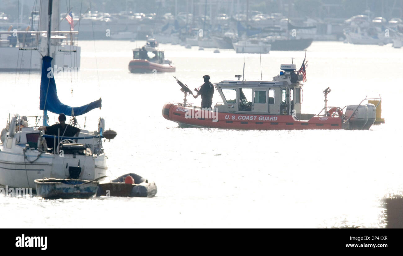 Aug 17, 2006; San Diego, CA, USA; A Coast Guard Rigid Hull Inflatable boat does security work aftert the arrival of the 87-foot cutter Petrel with Javier Arellano Felix and those captured with him aboard at the dock of the Coast Guard station on Harbor Drive. Also known as  'El Tigrillo,' or 'little tiger,' Arellano, 37, is one of seven leaders in the Arellano Felix organization na Stock Photo