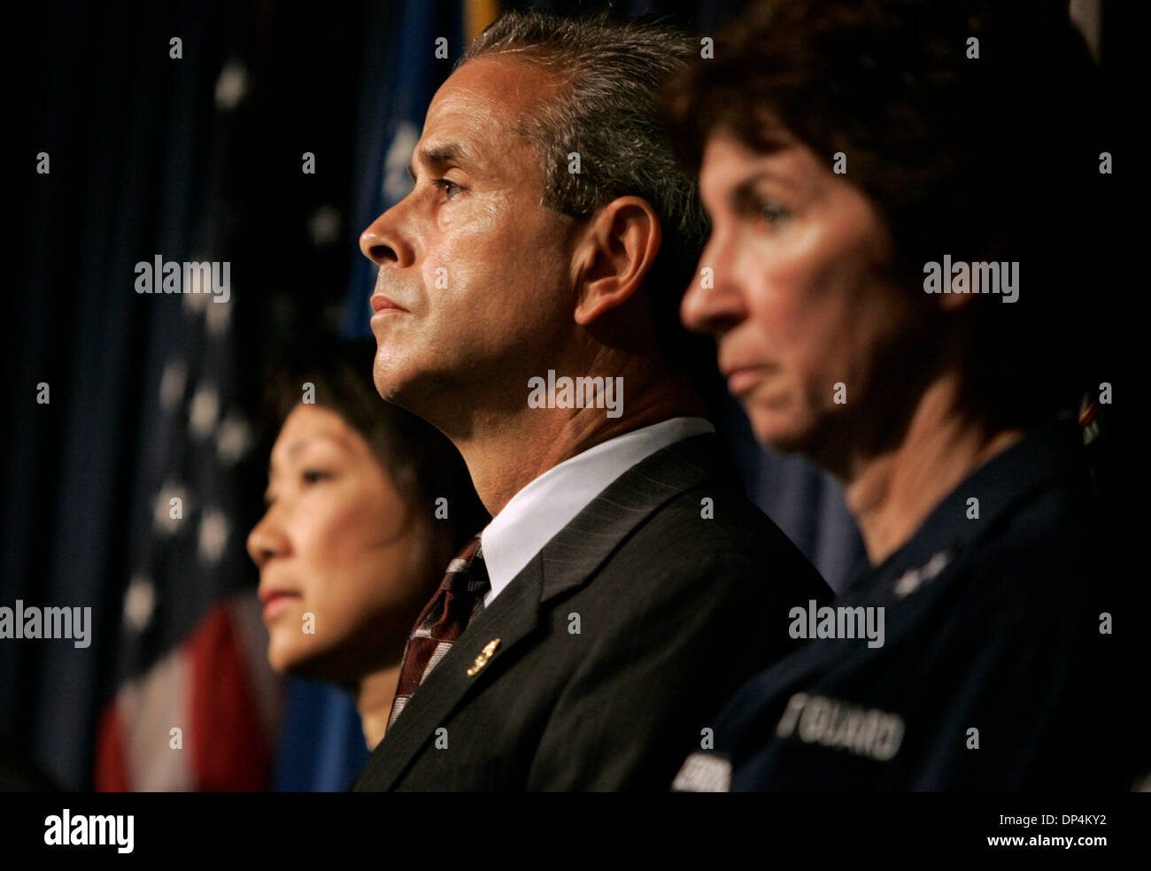 Aug 17, 2006; San Diego, CA, USA; US Attorney CAROL LAM, left, JOHN FERNANDES, Special Agent in Charge of the San Diego Office of the DEA, center, and US COAST GUARD Rear Admiral JODY BRECKENRIDGE, right, listen to a press conference discussing the arrest on Monday August 14, 2006 in international waters off Baja California of  Francisco Javier Arellano Felix, the kingpin of the Ar Stock Photo
