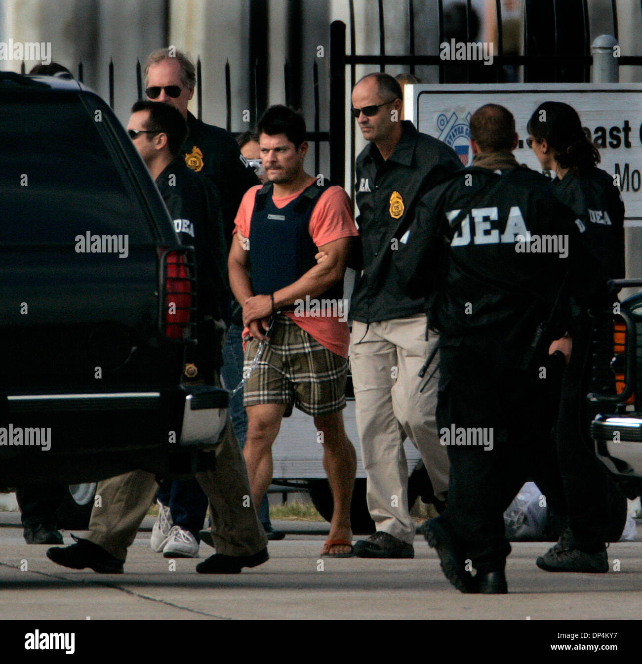 Aug 17, 2006; San Diego, CA, USA; Suspect FRANCISCO JAVIER ARELLANO FELIX  in the Arellano-Felix drug cartel is taken from a US Coast Guard vessel to a waiting DEA SUV at the San Diego Coast Guard Station. The suspects, as many as 11 were arrested in international waters off the coast of Baja California on Monday August 14, 2006 while they were deep-sea fishing. FRANCISCO JAVIER AR Stock Photo