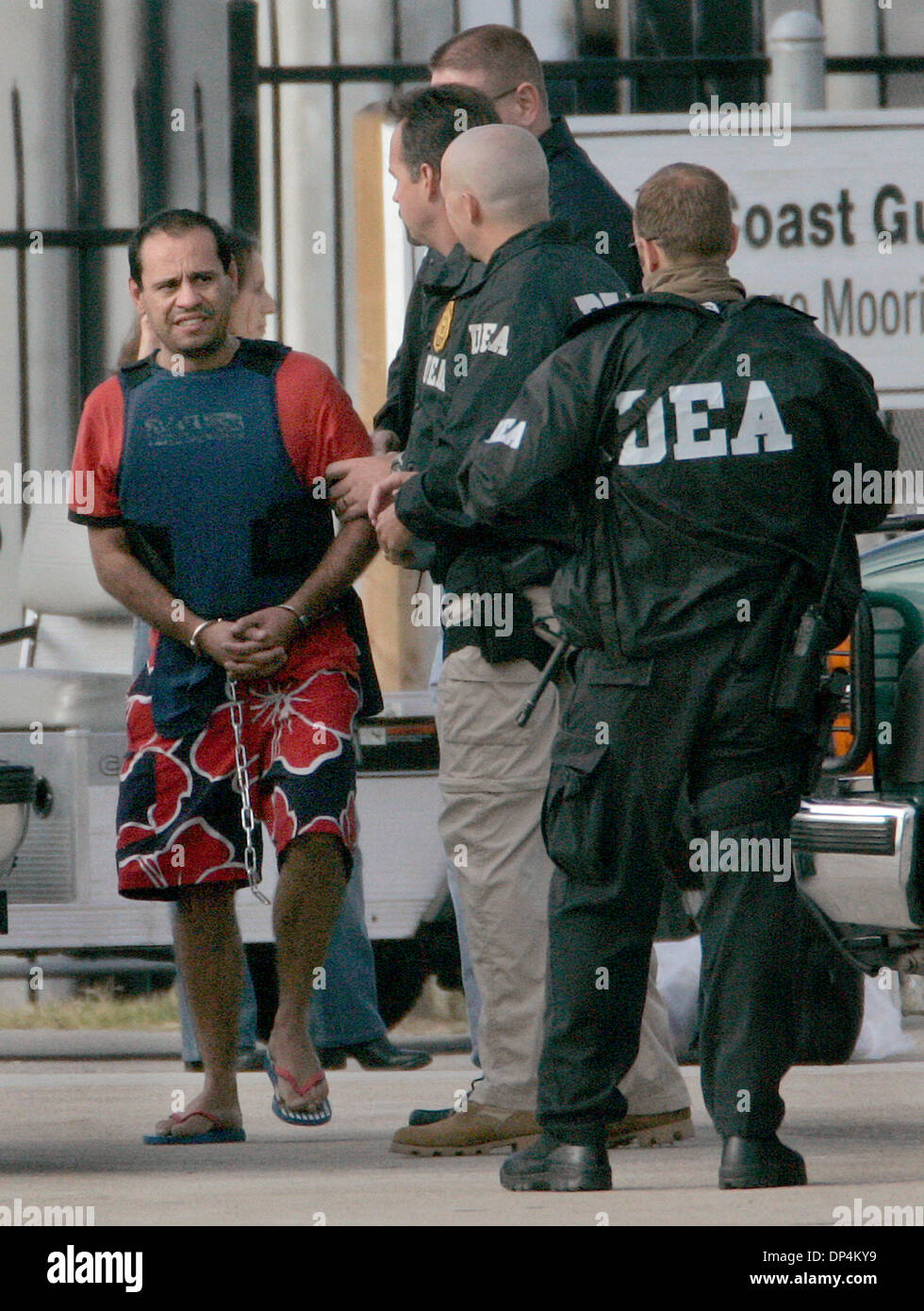 Aug 17, 2006; San Diego, CA, USA; An Alleged suspect in the Arellano-Felix drug cartel is taken from a US Coast Guard vessel to a waiting DEA SUV at the San Diego Coast Guard Station. The suspects, as many as 11 were arrested in international waters off the coast of Baja California on Monday August 14, 2006 while they were deep-sea fishing. Those arrested included Francisco Javier  Stock Photo