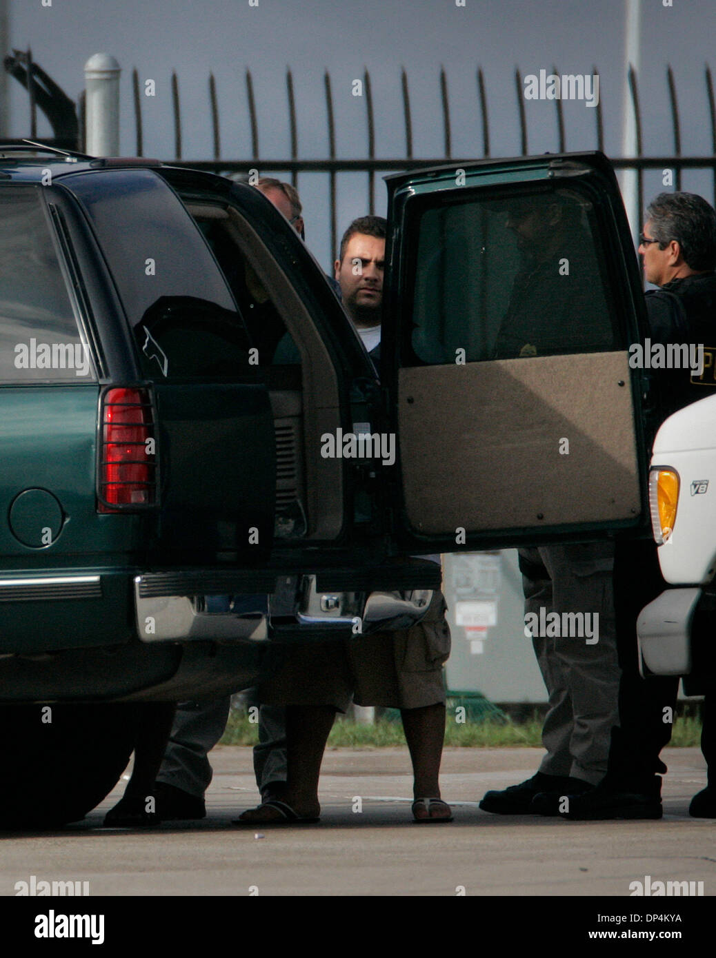 Aug 17, 2006; San Diego, CA, USA; An Alleged suspect in the Arellano-Felix drug cartel is taken from a US Coast Guard vessel to a waiting DEA SUV at the San Diego Coast Guard Station. The suspects, as many as 11 were arrested in international waters off the coast of Baja California on Monday August 14, 2006 while they were deep-sea fishing. Those arrested included Francisco Javier  Stock Photo