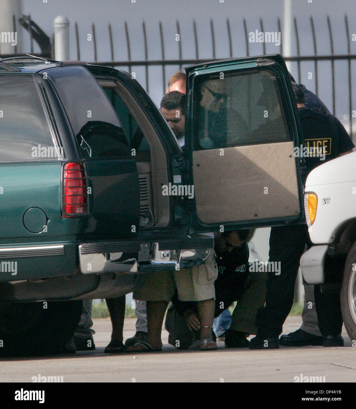 Aug 17, 2006; San Diego, CA, USA; An Alleged suspect in the Arellano-Felix drug cartel is taken from a US Coast Guard vessel to a waiting DEA SUV at the San Diego Coast Guard Station. The suspects, as many as 11 were arrested in international waters off the coast of Baja California on Monday August 14, 2006 while they were deep-sea fishing. Those arrested included Francisco Javier  Stock Photo