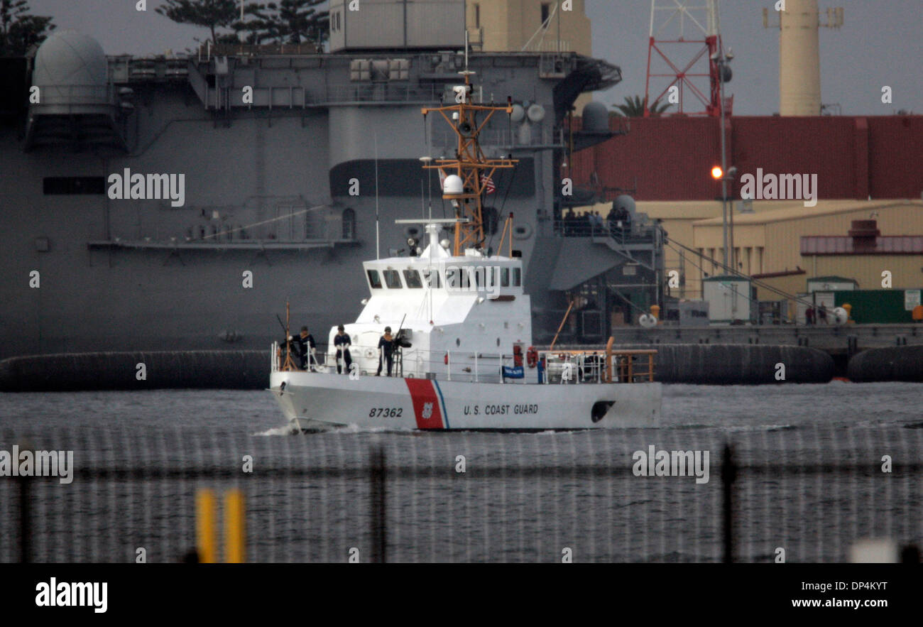 Aug 17, 2006; San Diego, CA, USA; Alledged members of the Arellano-Felix drug cartel were taken from a Coast Guard vessel and put into waiting SUV's to be taken to the Federal Courthouse in San Diego to be arraigned on August 17, 2006.  They were apprehended off the coast of Baja California, Mexico, in international waters on Monday, August 14, 2006. A Coast Guard patrol vessel sto Stock Photo