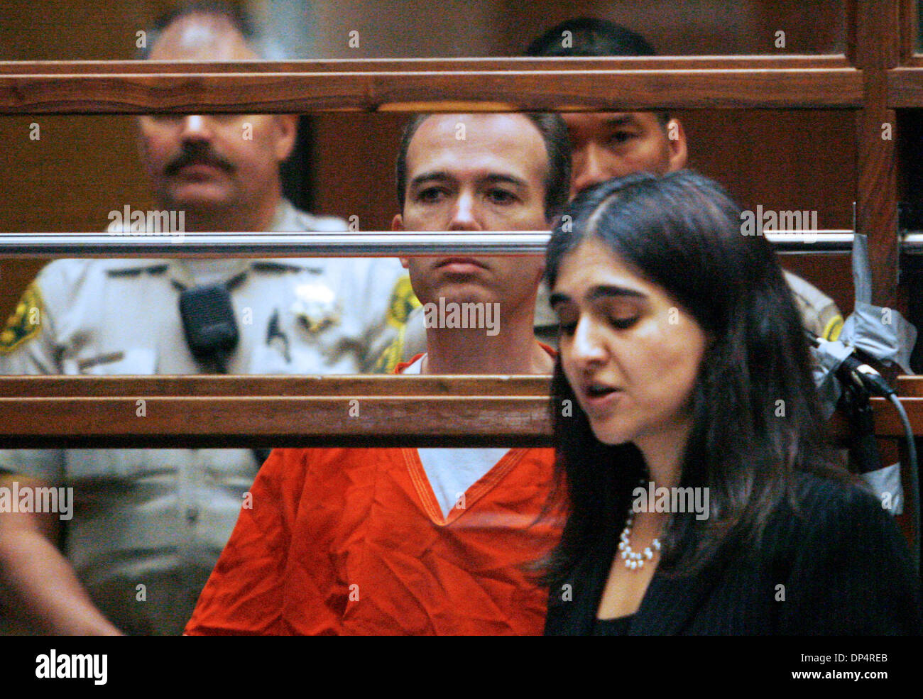 Aug 22, 2006; Los Angeles, CA, USA; JOHN MARK KARR looks at his attorney, Haydeh Takasugi,  LA County deputy public defender, during his extradition hearing at LA Superior Court. Karr, the suspect in the murder of 6-year-old JonBenet Ramsey, waived his rights and will be sent to Colorado, where the body of the child beauty queen was found a decade ago. Mandatory Credit: Photo by Ma Stock Photo