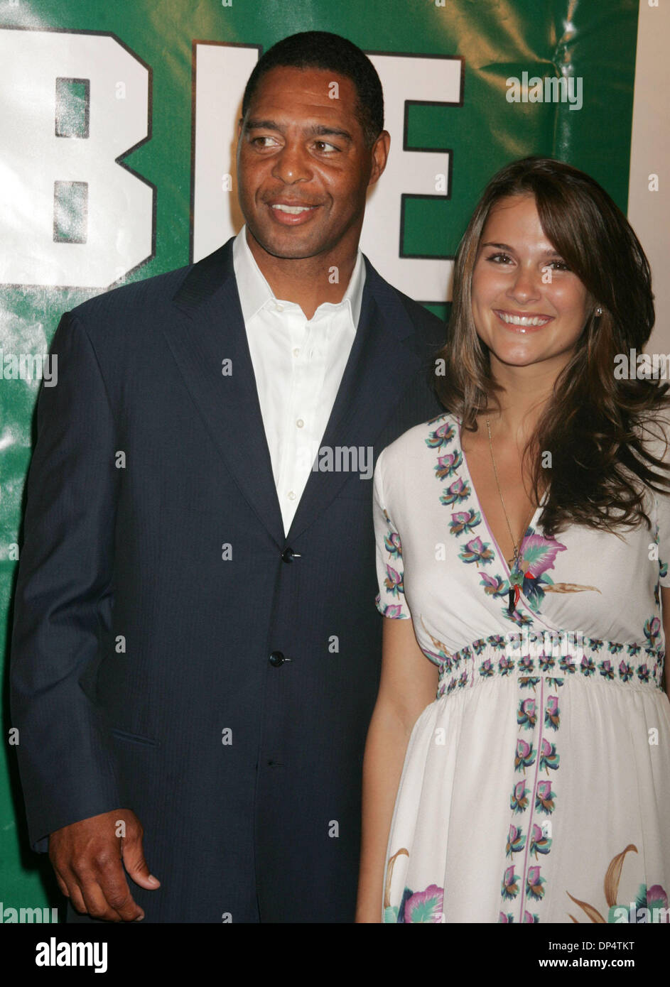 Aug 23, 2006; New York, NY, USA; Football player MARCUS ALLEN and WIFE at the arrivals for the New York premiere of 'Invincible' held at the Ziegfeld Theater. Mandatory Credit: Photo by Nancy Kaszerman/ZUMA Press. (©) Copyright 2006 by Nancy Kaszerman Stock Photo