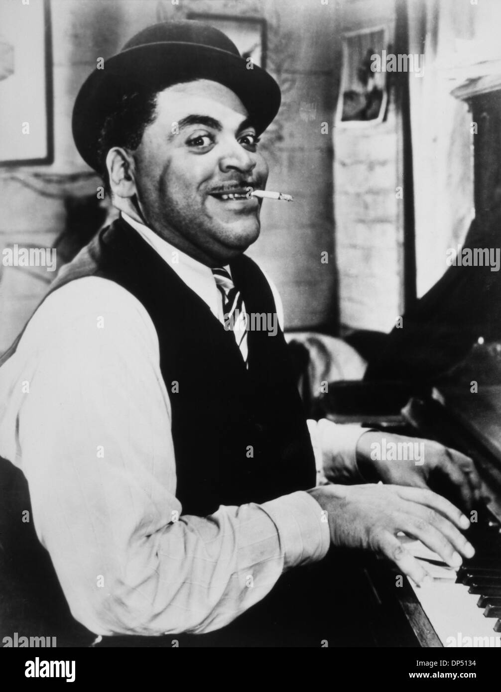 Fats Waller (1904-1943), American Jazz Pianist, Composer and Singer, Playing Piano while Smoking Cigarette, 1942 Stock Photo