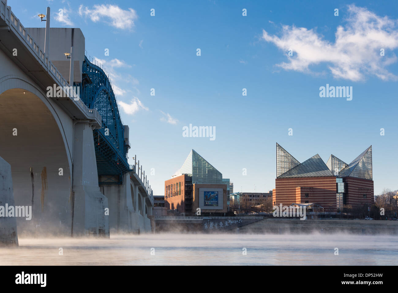 Steam rising off the Tennessee River in front of the Tennessee Aquarium on a cold, clear winter morning Stock Photo