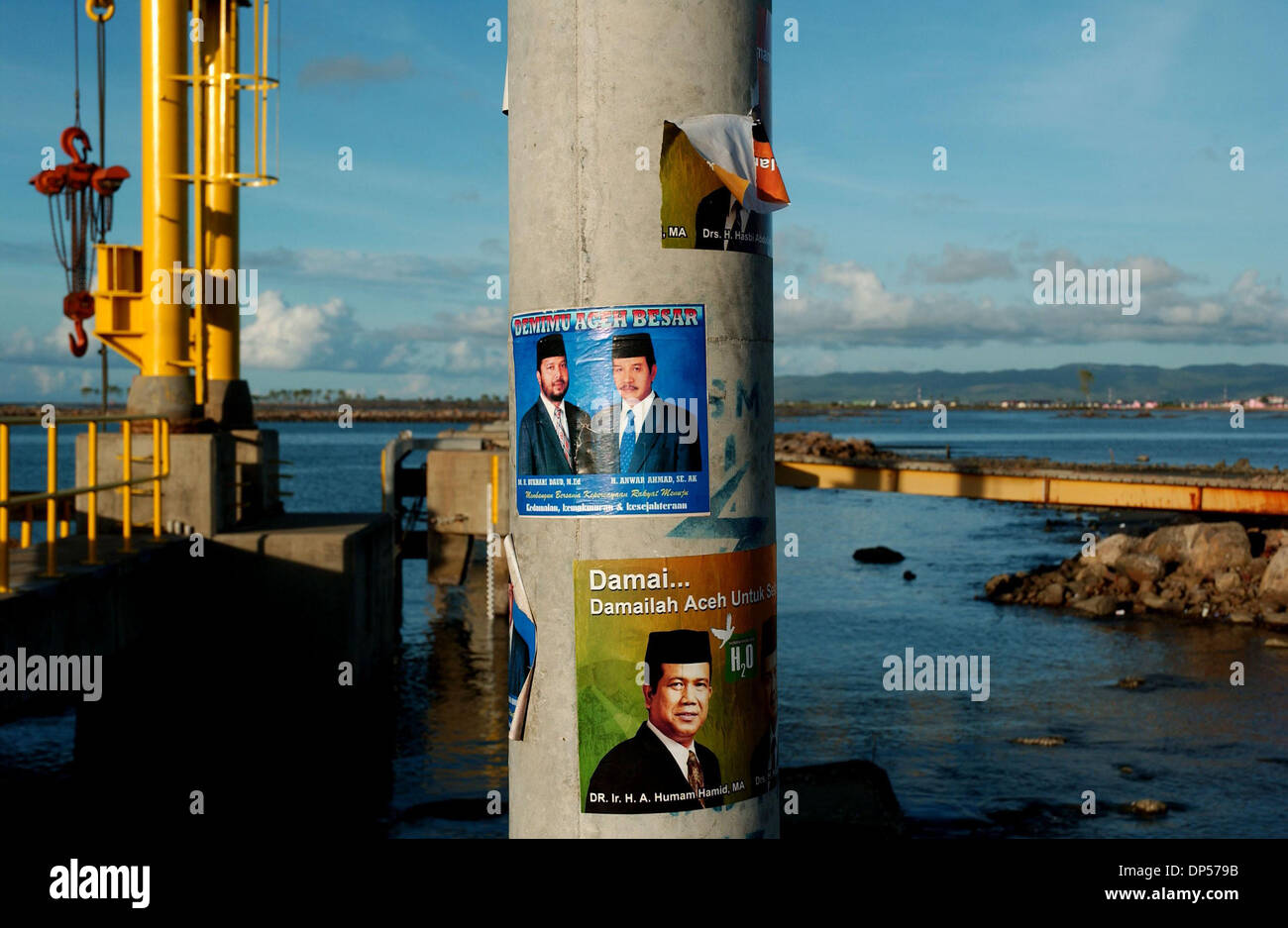 Sep 06, 2006; Banda Aceh, INDONESIA; Posters of the potential candidates of Acehnese governor are placed at electrical pole at Ulhe Lheu sea port the area where worst hit by Indian ocean tsunami in Aceh. Sign of routine life have returned to the people of Aceh after Indian ocean tsunami hit the region on December 26, 2004 where an estimated 167.000 killed and some 500.000 homeless. Stock Photo