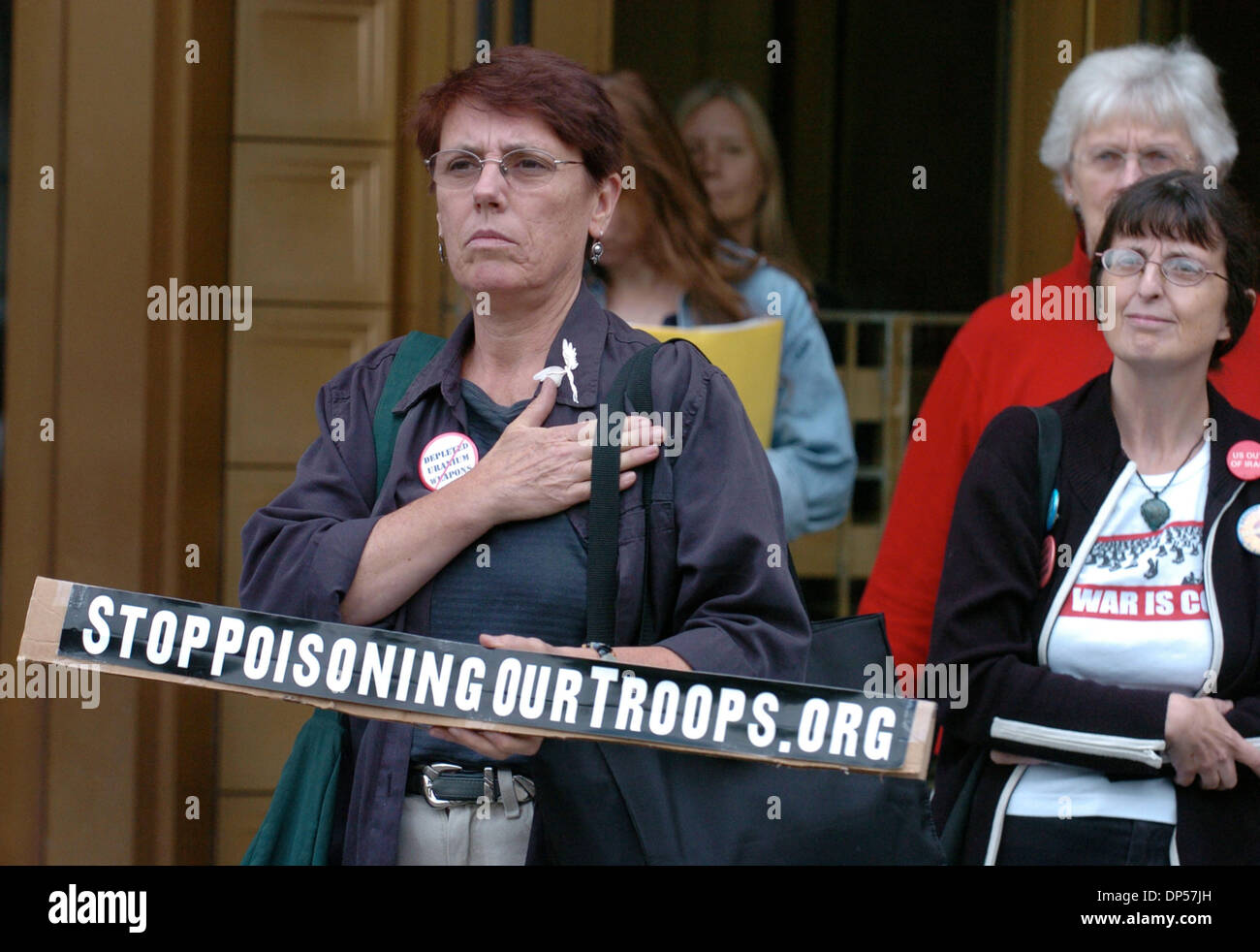 Sep 06, 2006; Manhattan, NY, USA; Supporter ANGELA MORANO of NY holds a sign as she exits Federal Court. Former members of the U.S. Army that served in Iraq attend a hearing in Manhattan Federal Court on the validity of a lawsuit they filed in 2005 against the U.S. Government for compensation for their illnesses and medical expenses for 'Gulf War Syndrome' symptoms they say are rel Stock Photo
