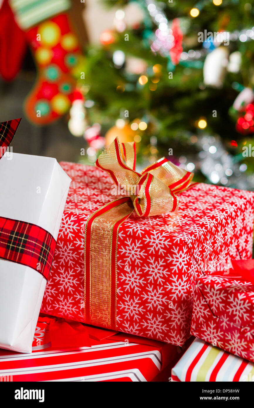 Christmas presents wrapped in colorful paper Stock Photo - Alamy