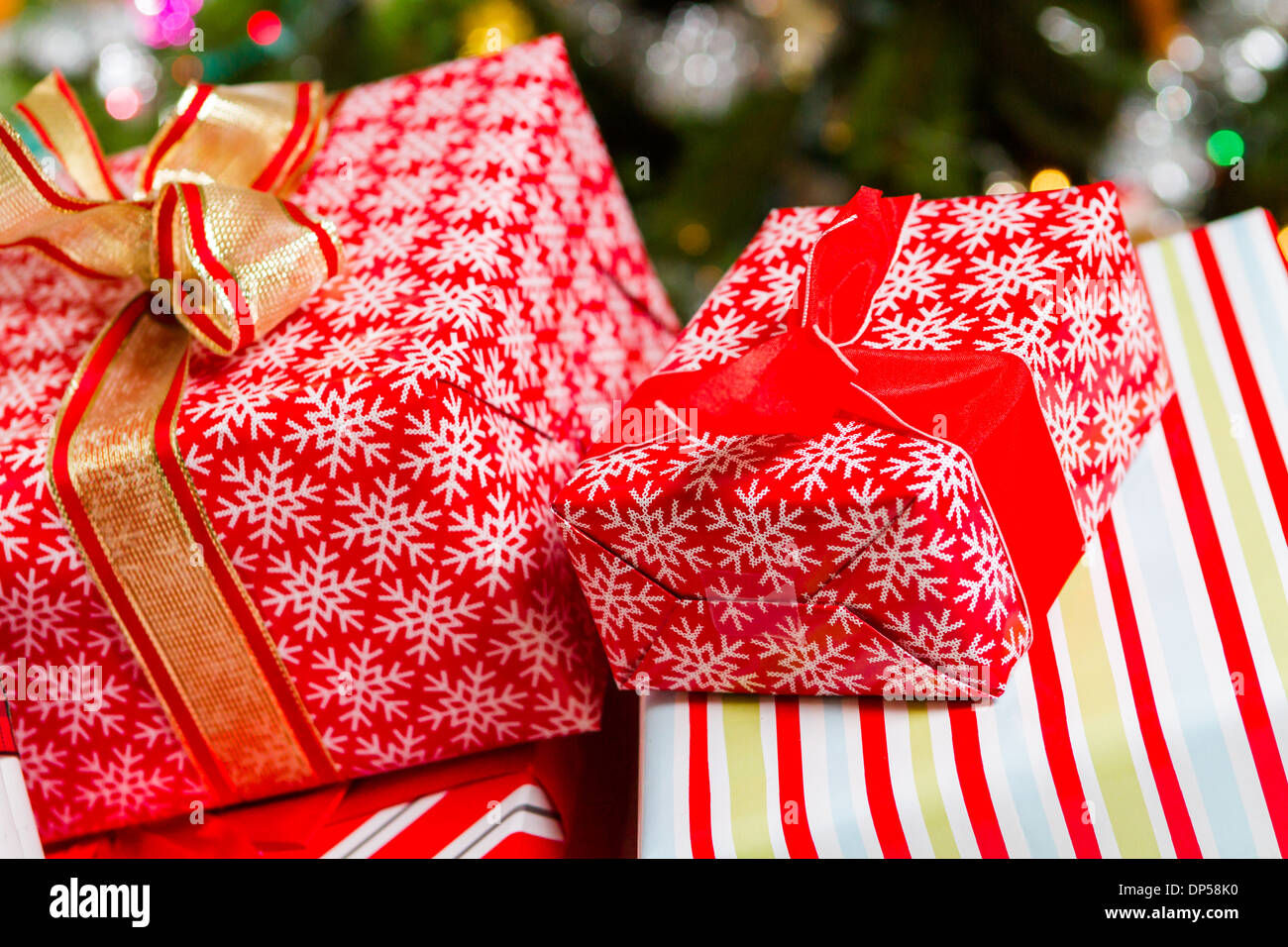 Christmas presents wrapped in colorful paper Stock Photo - Alamy