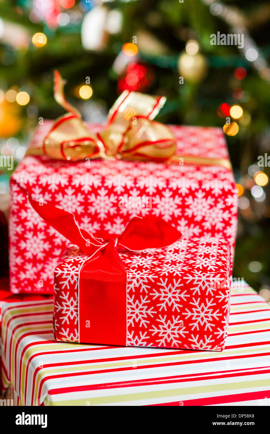 Christmas presents wrapped in colorful paper Stock Photo - Alamy