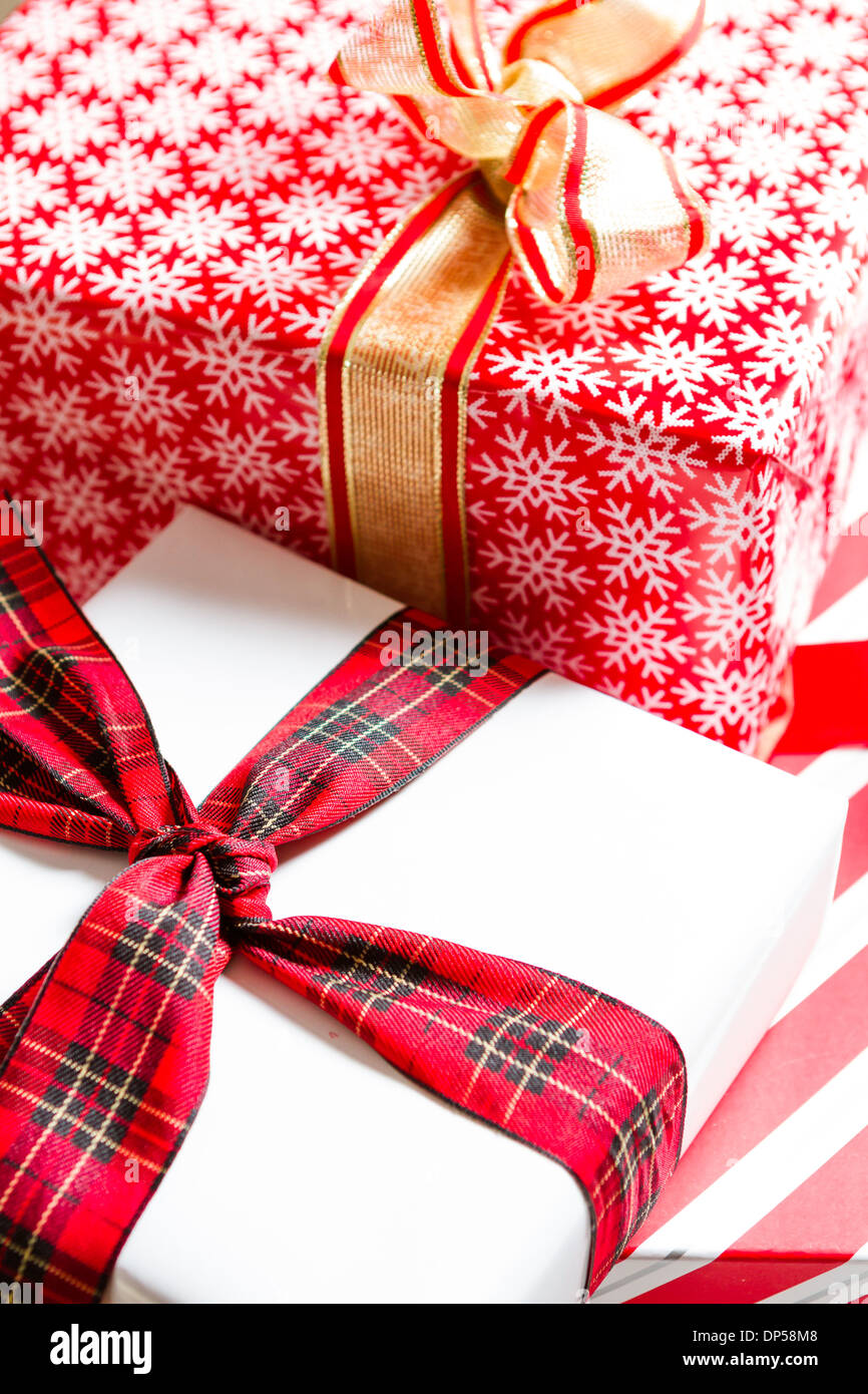 Christmas presents wrapped in colorful paper Stock Photo - Alamy