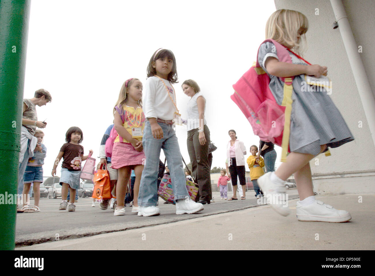 Sep 07, 2006; Imperial Beach, CA, USA; At middle rear (sleeveless top),  pre-kindergarten teacher CAROL MENDOZA as her 4-year-old students file into  class at Imperial Beach Elementary School. Six communities in the