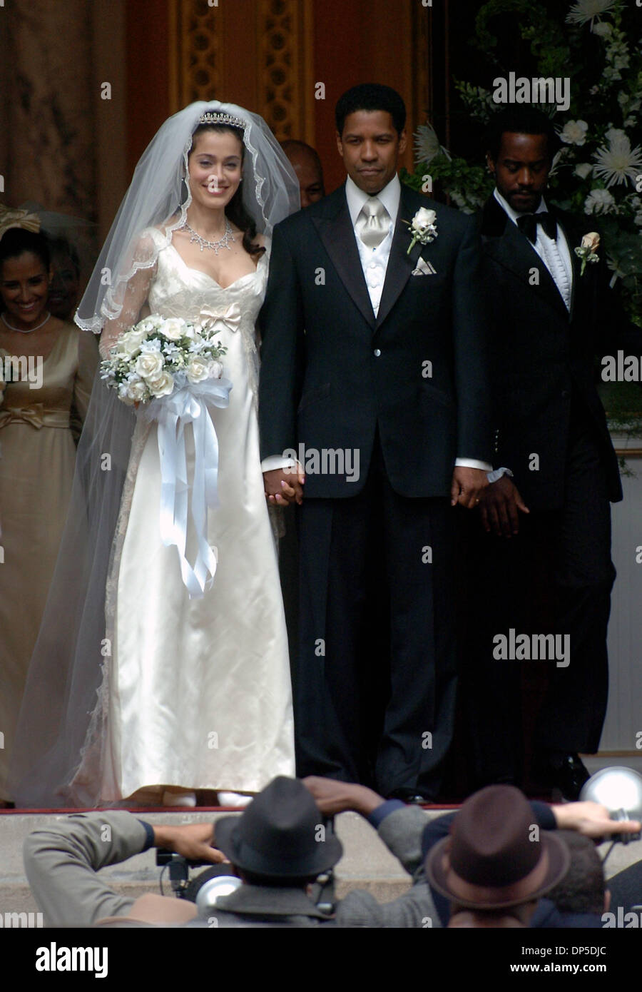 Sep 13, 2006; Manhattan, NY, USA; Actors DENZEL WASHINGTON and LYMARI NADAL film a wedding scene on the steps of Mt. OIivet Baptist Church in Harlem from the upcoming film 'American Gangster,' based on the true story of a Harlem drug dealer. Denzel Washington plays Frank Lucas, a.k.a 'Superfly' who smuggled heroin out of Southeast Asia in the caskets of soldiers killed in Vietnam.  Stock Photo