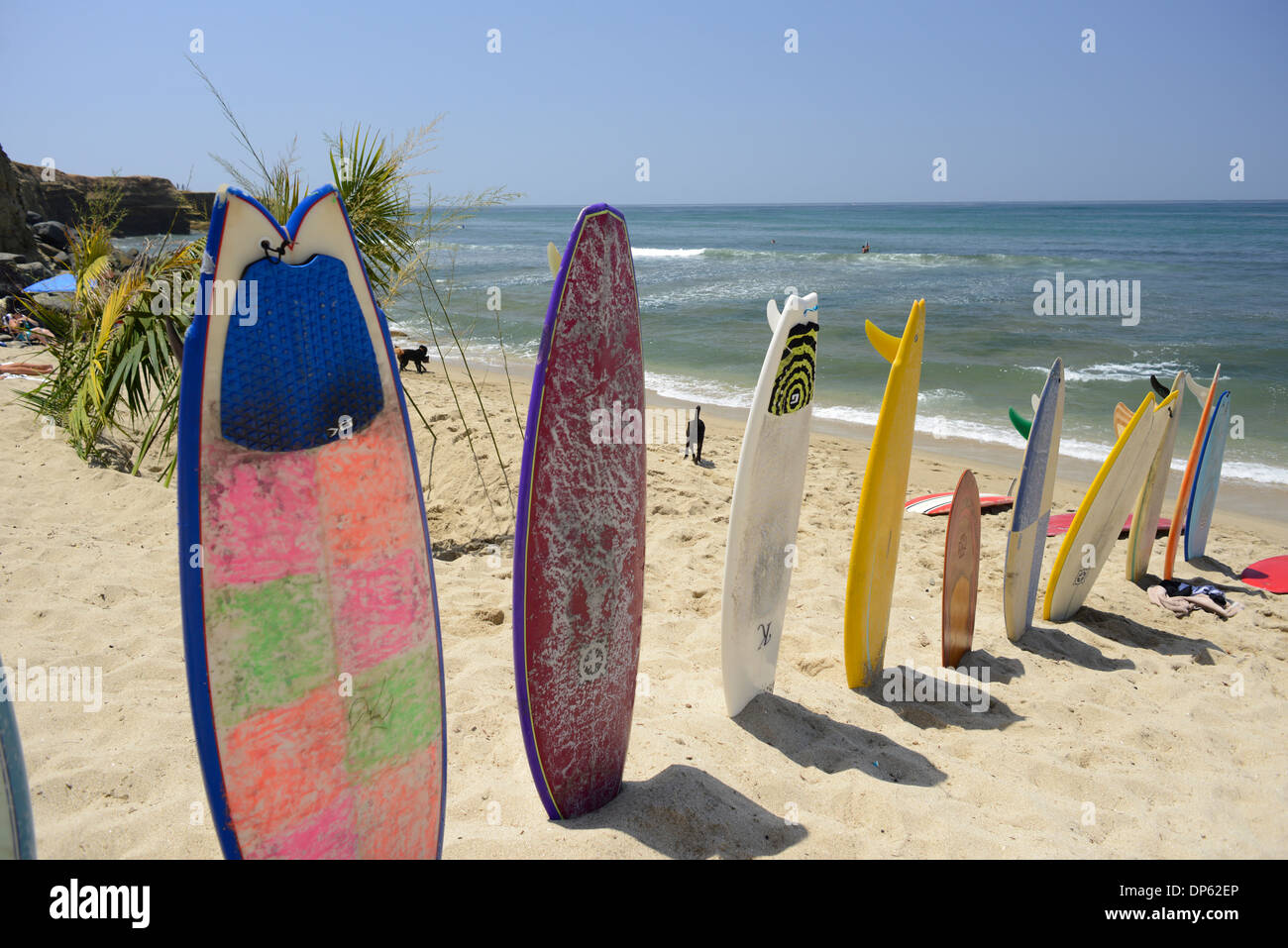 Surfboards lined up in sand in Ocean Beach, San Diego, California