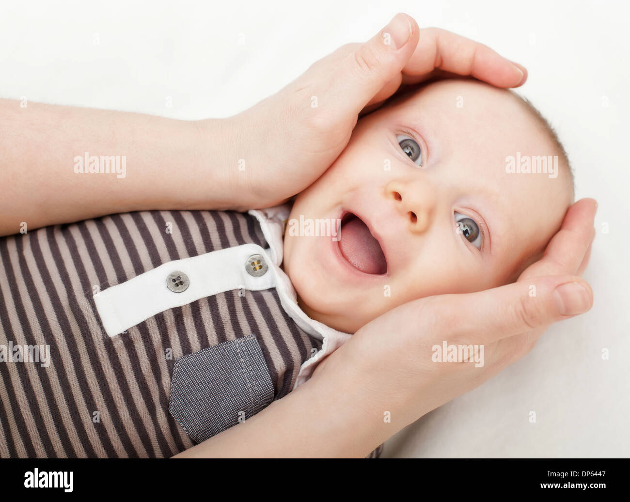 woman hands hold little child Stock Photo