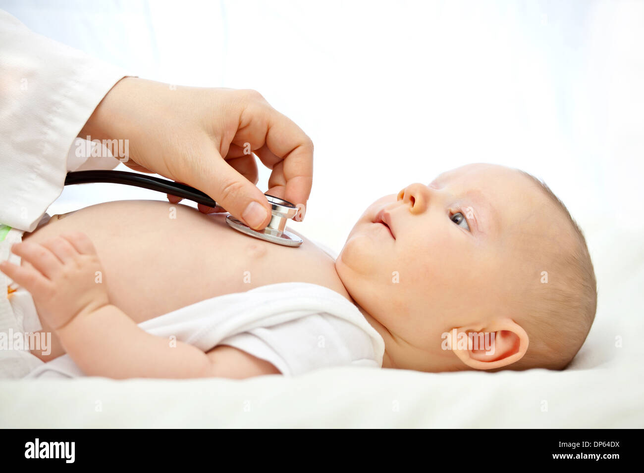 baby portrait and pediatrician check Stock Photo