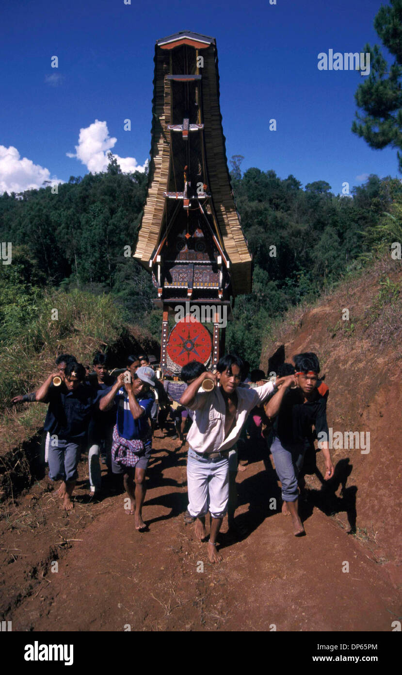 Oct 09, 2006; Toraja, South Sulawesi, INDONESIA; Relatives carry a coffin to the grave during a Torajan funeral. The funeral is the most important of all Torajan ceremonies as it concerns with sending a dead person to the afterworld.  Without proper funeral rites, the spirit of the deceased will cause misfortune to its family.  Mandatory Credit: Photo by Edy Purnomo/JiwaFoto/ZUMA P Stock Photo