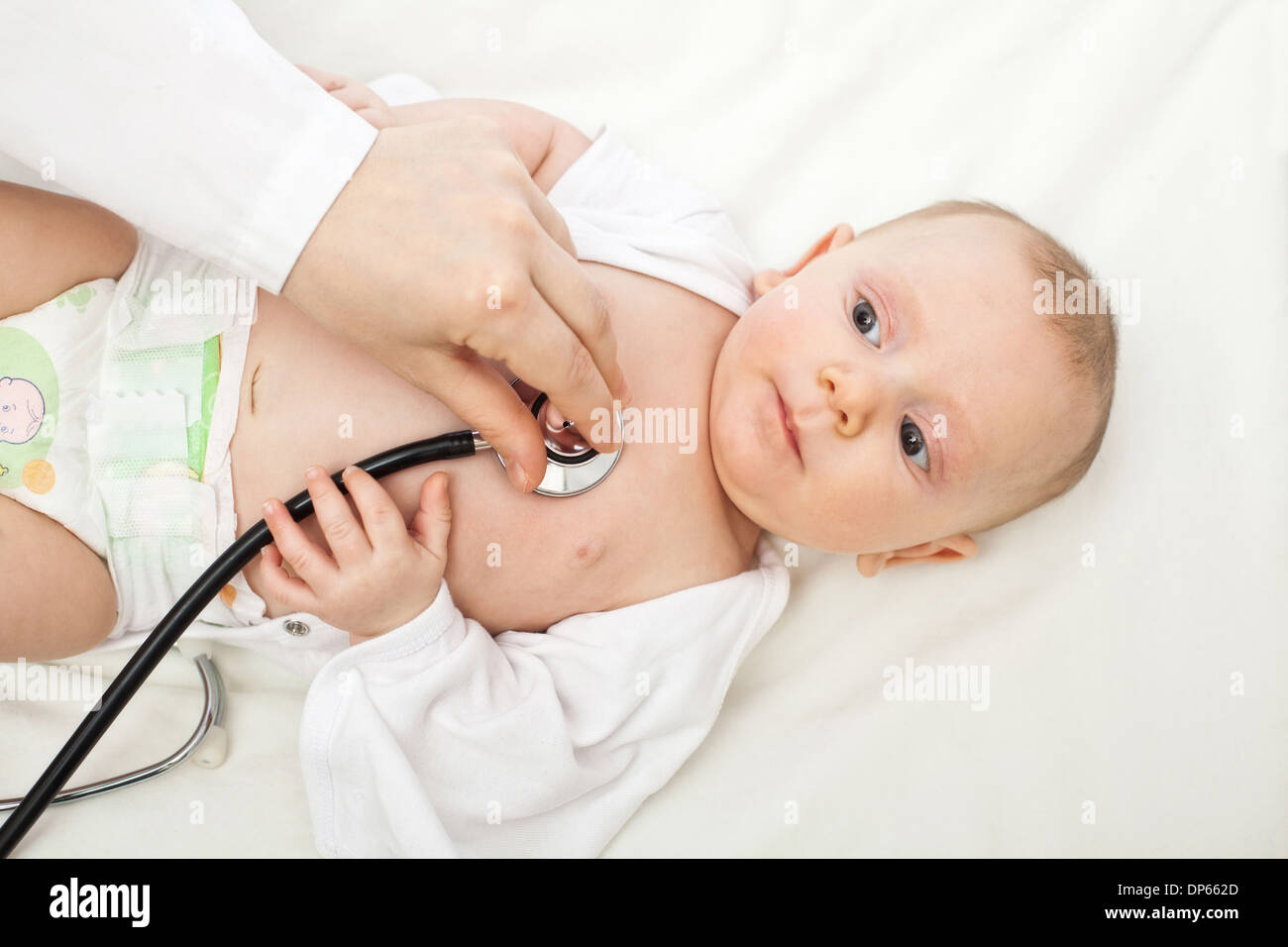 baby portrait and pediatrician check Stock Photo
