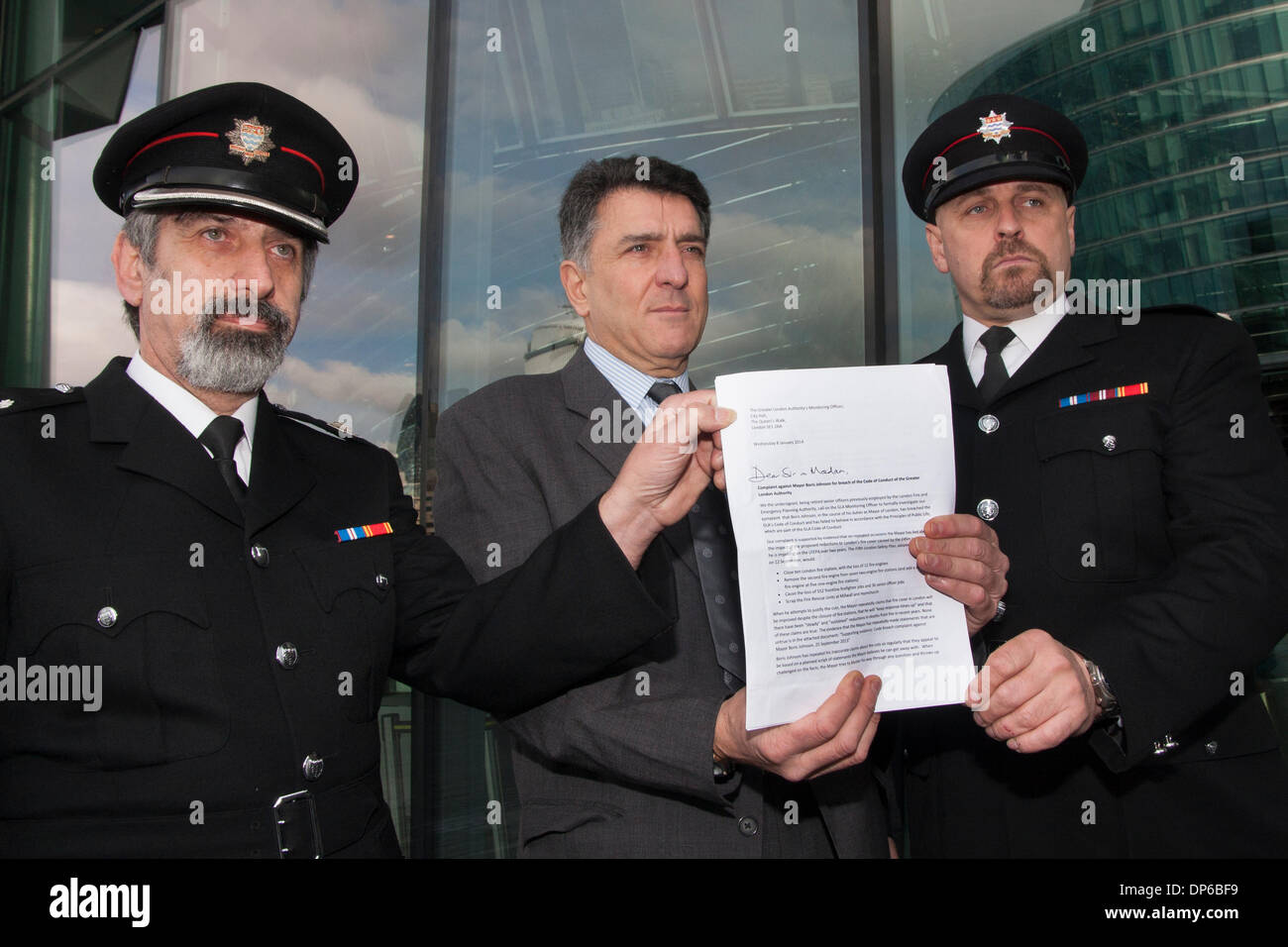 London, January 8th 2014. Firefighters deliver a letter of complaint to City hall ahead of planned closures of 8 fire stations in London. Credit:  Paul Davey/Alamy Live News Stock Photo