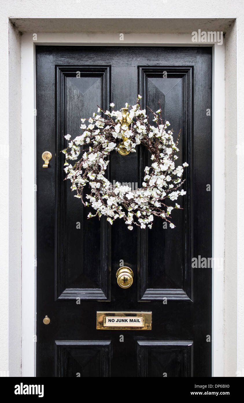 Christmas wreath on a black door Stock Photo