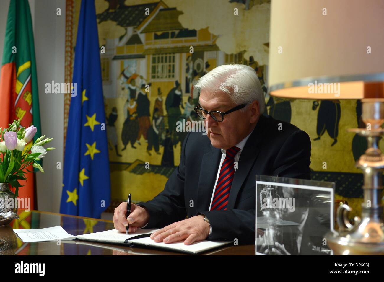 Berlin, Germany. 8th Jan, 2014. Federal Minister for Foreign Affairs Frank-Walter Steinmeier (SPD) signs the condolence book in memory of the Portuguese football player EusÌÄ©bio (aka Black Panther) in the Portuguese Embassy in Berlin, on January 8, 2014. Credit:  Goncalo Silva/NurPhoto/ZUMAPRESS.com/Alamy Live News Stock Photo