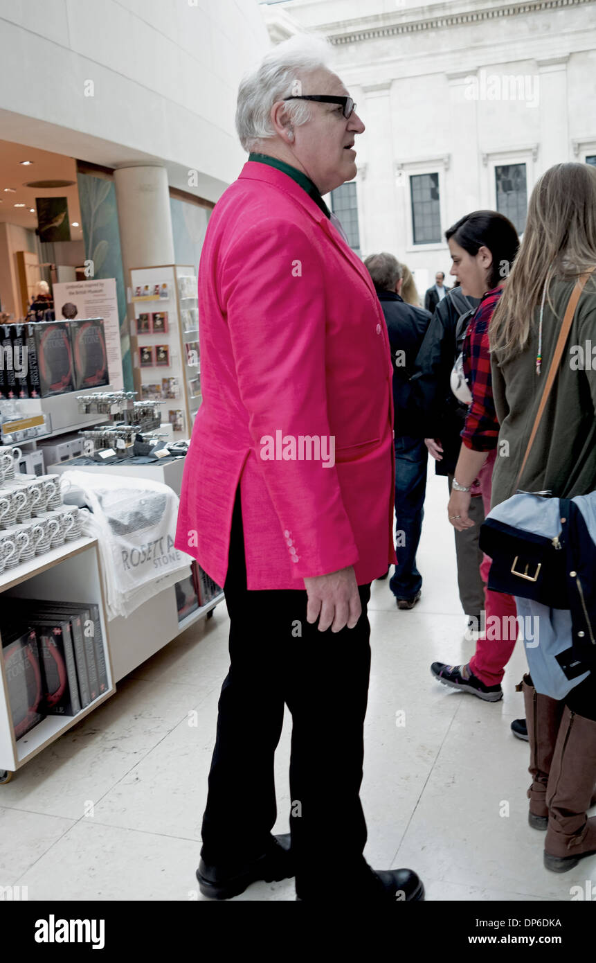 A man in a loud pink jacket. Stock Photo