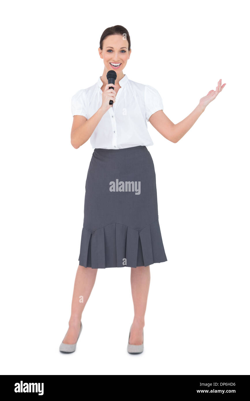 Smiling presenter holding microphone Stock Photo