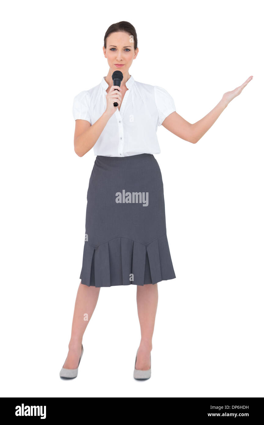 Peaceful presenter holding microphone Stock Photo