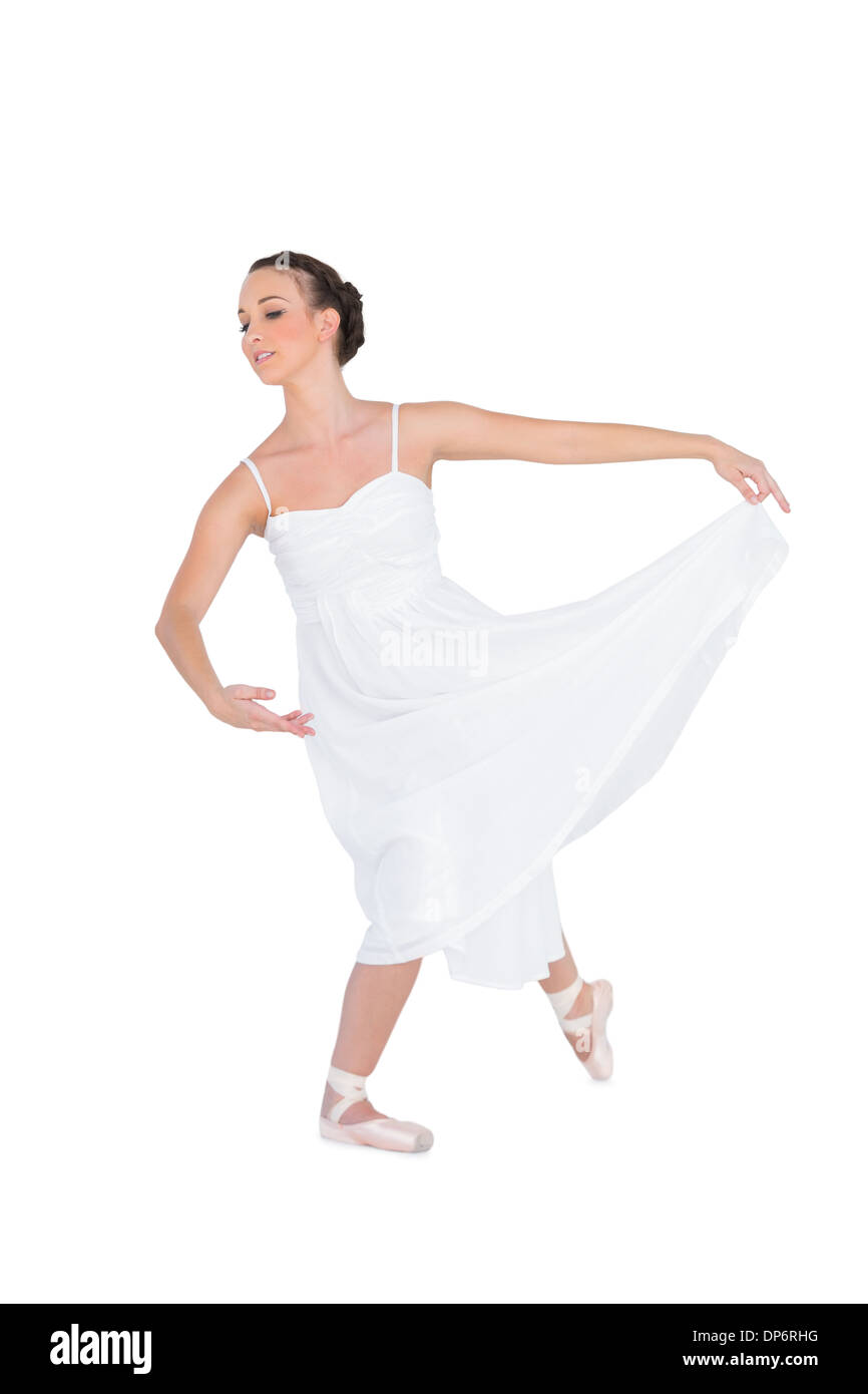 Focused young ballet dancer posing with her leg back Stock Photo
