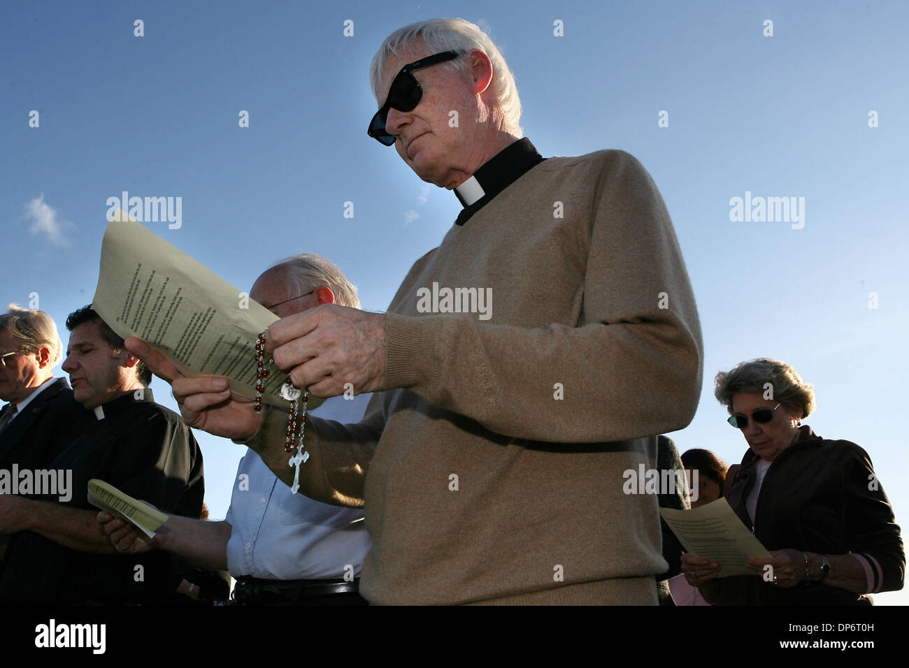 Oct 25, 2006; Starke, FL, USA; Father Fred R. Ruse, of St. John Vianney Catholic Church in Orlando prays with other demonstrators outside of the Florida State Prison in Starke, where convicted serial killer Danny Rolling was executed by lethal injection on October 25, 2006.  Rolling was responsible for the slaying of five college students in 1990. Mandatory Credit: Photo by J. Gwen Stock Photo
