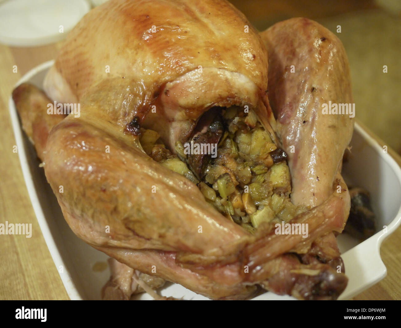 stuffing leaking out from a home cooked turkey during thanksgiving Stock Photo
