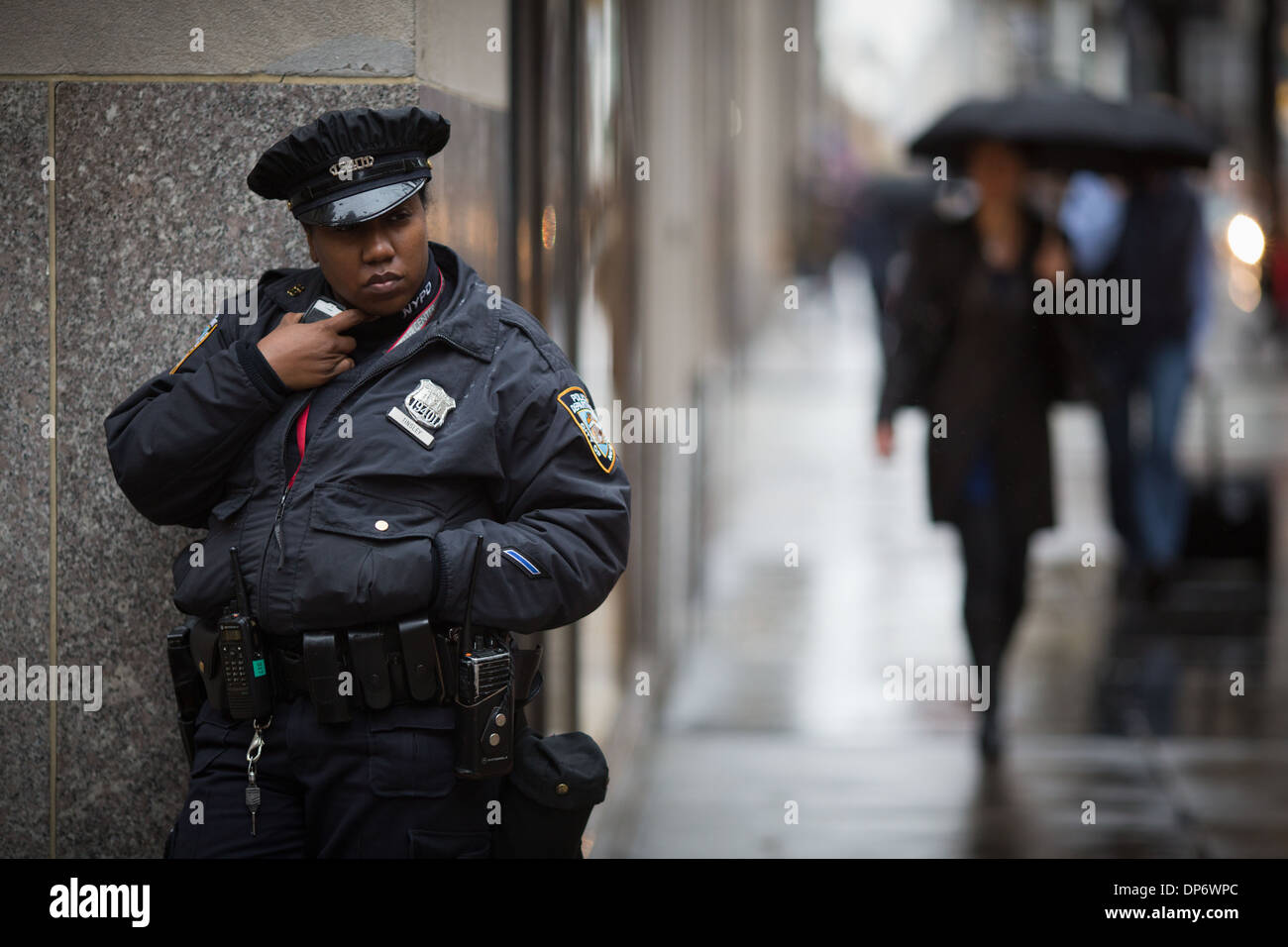 A black New York city police officer on 5th Avenue making a call Stock Photo