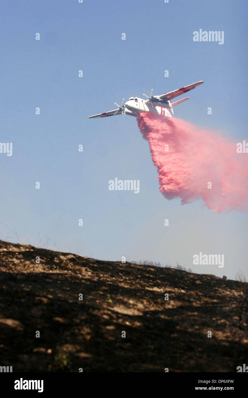 Oct 27, 2006; Richmond, CALIFORNIA, USA; A CDF plane drops fire ...